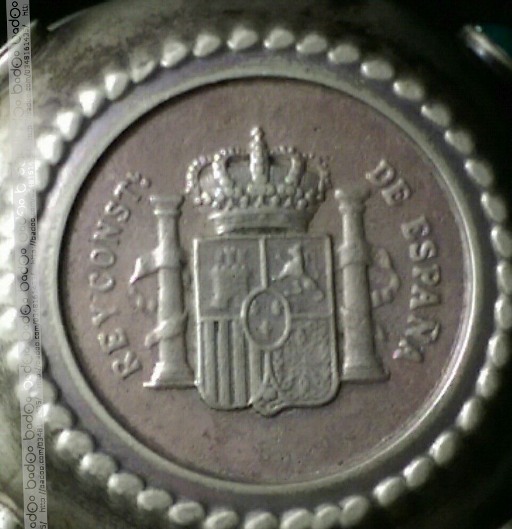 Photo 1 Pièce de monnaie non identifiée: moneda incrustada